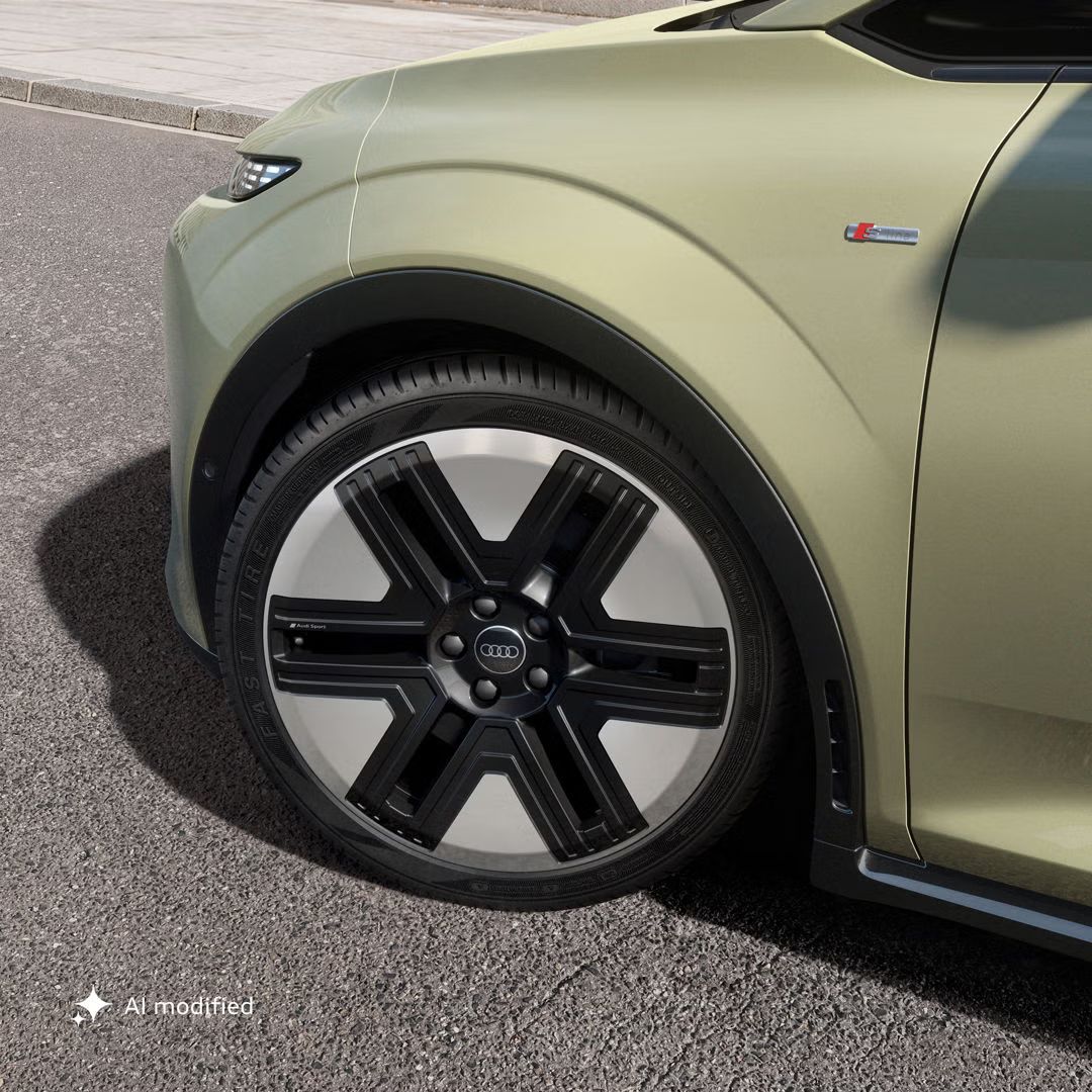 Detailný záber na 20-palcové koleso Audi A2 e-tron v aerodynamickom dizajne so šestimi lúčmi.