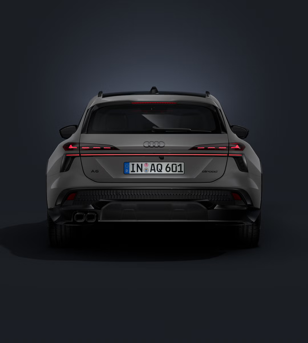 Audi A6 allroad zozadu na tmavom pozadí.