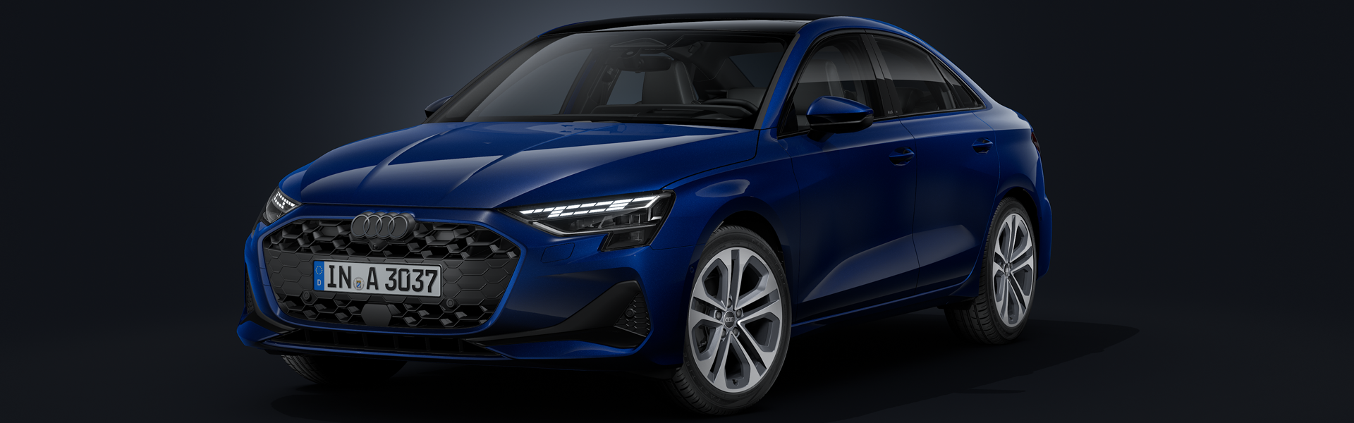 Audi A3 Limuzína z prednej strany na tmavom pozadí.