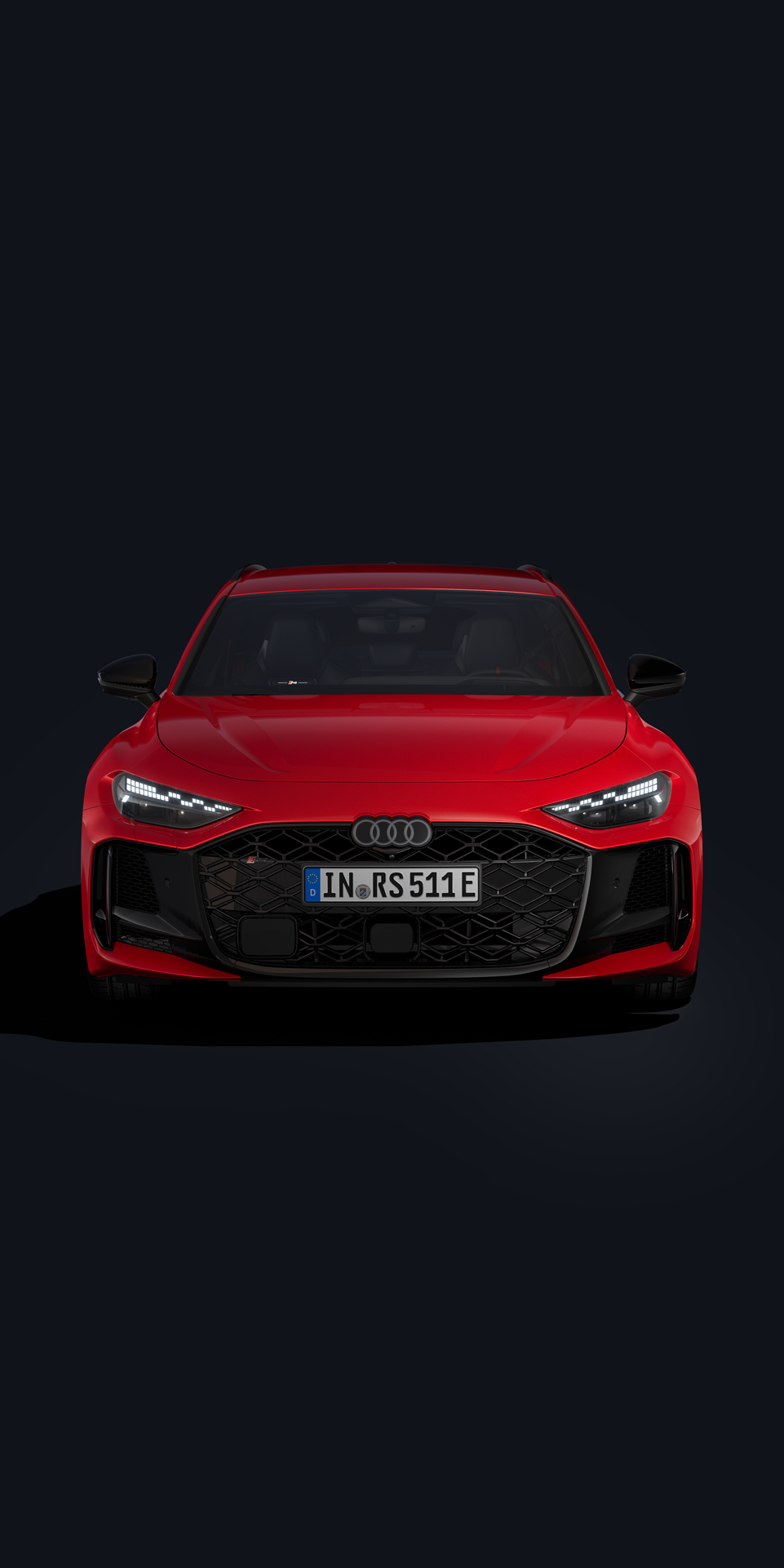 Na čiernom pozadí je zobrazené červené Audi RS 5 Avant.