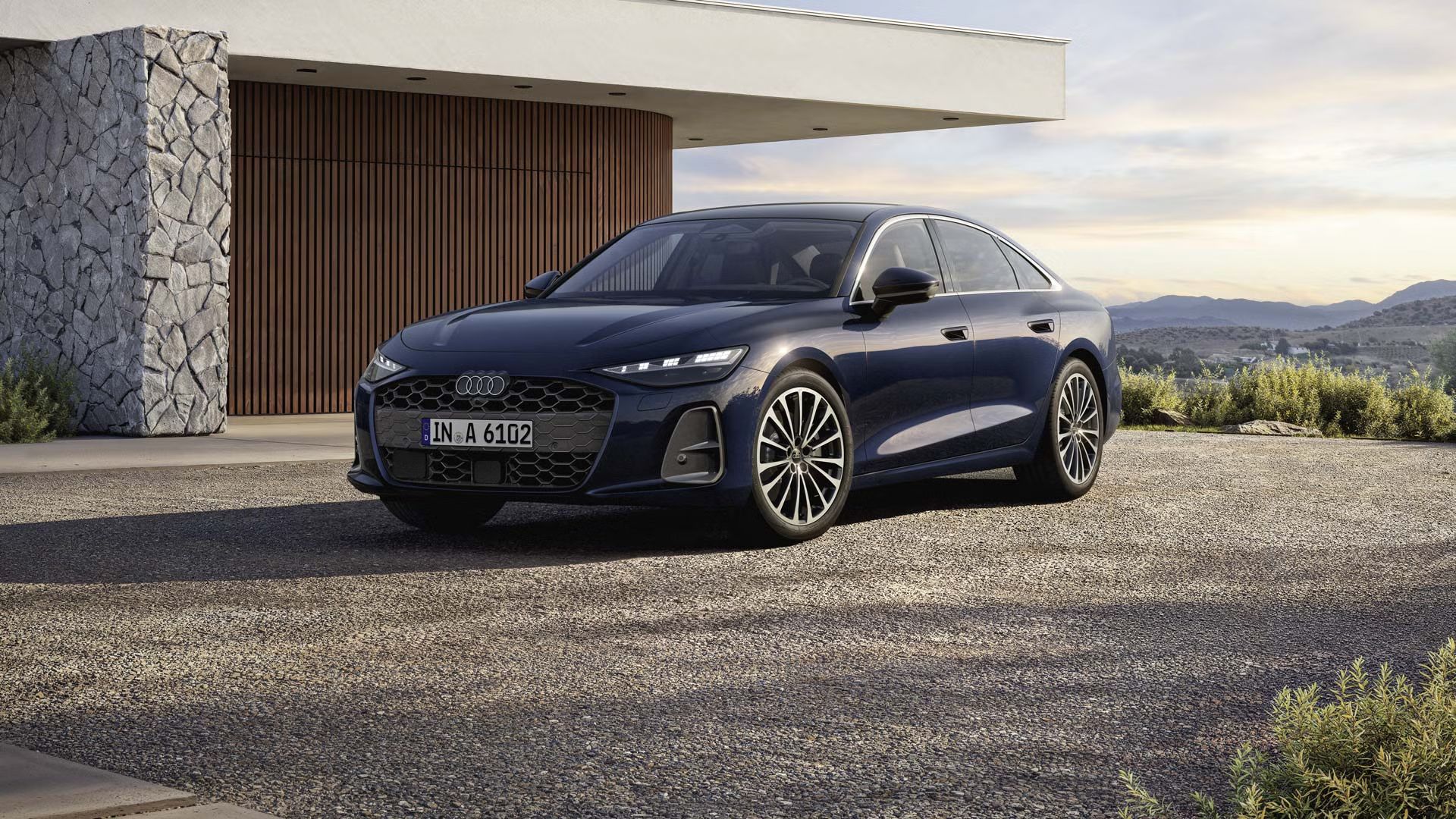 Audi A6 Limuzína stojí pred moderným domom. 