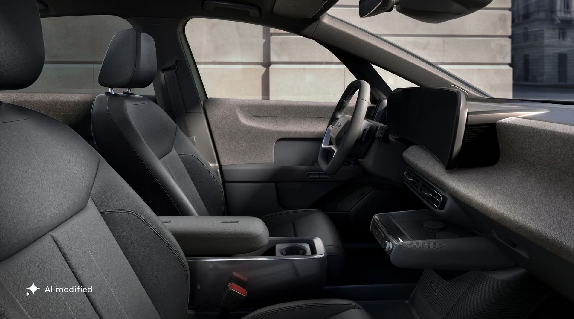 Pohľad zo strany spolujazdca na miesto vodiča Audi A2 e-tron so zameraním na predné sedadlá, volant a digitálne displeje.